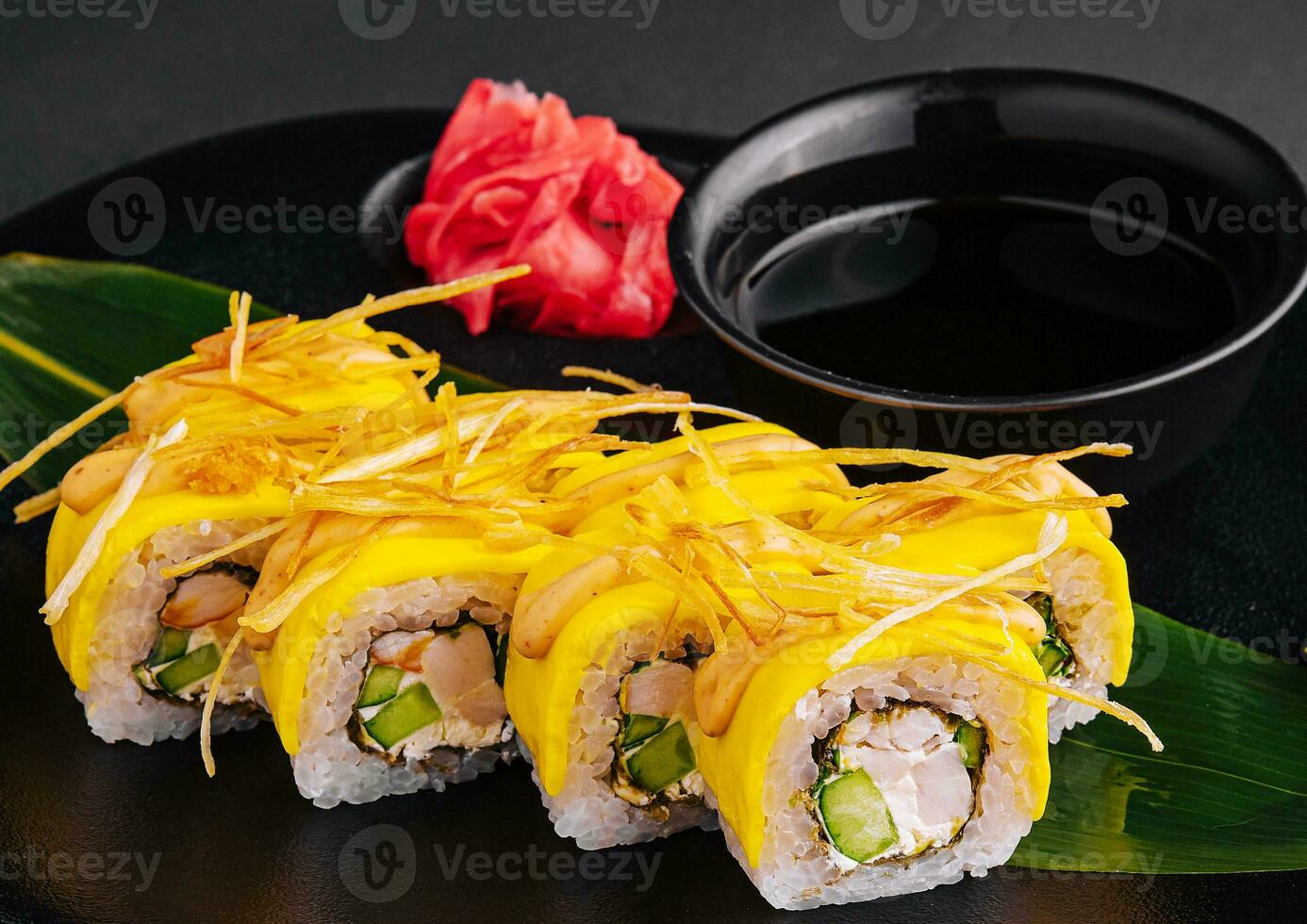 Yellow Sushi Rolls with shrimp and cucumbers photo