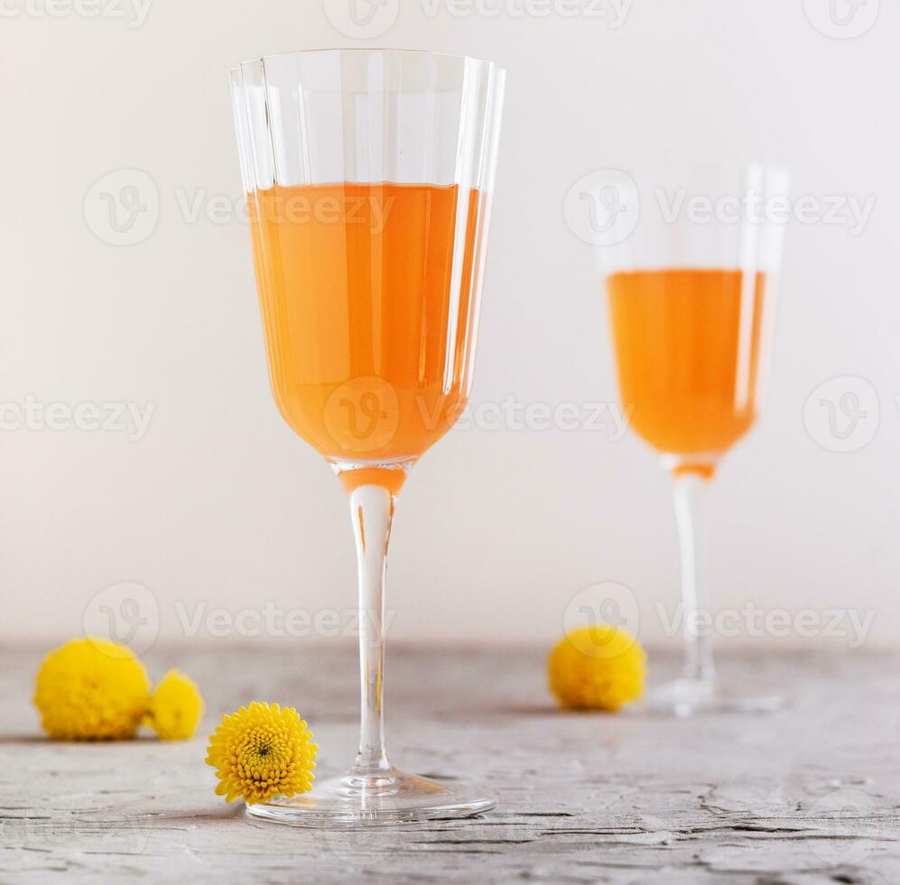 Mimosa alcohol cocktail with orange juice and dry champagne photo