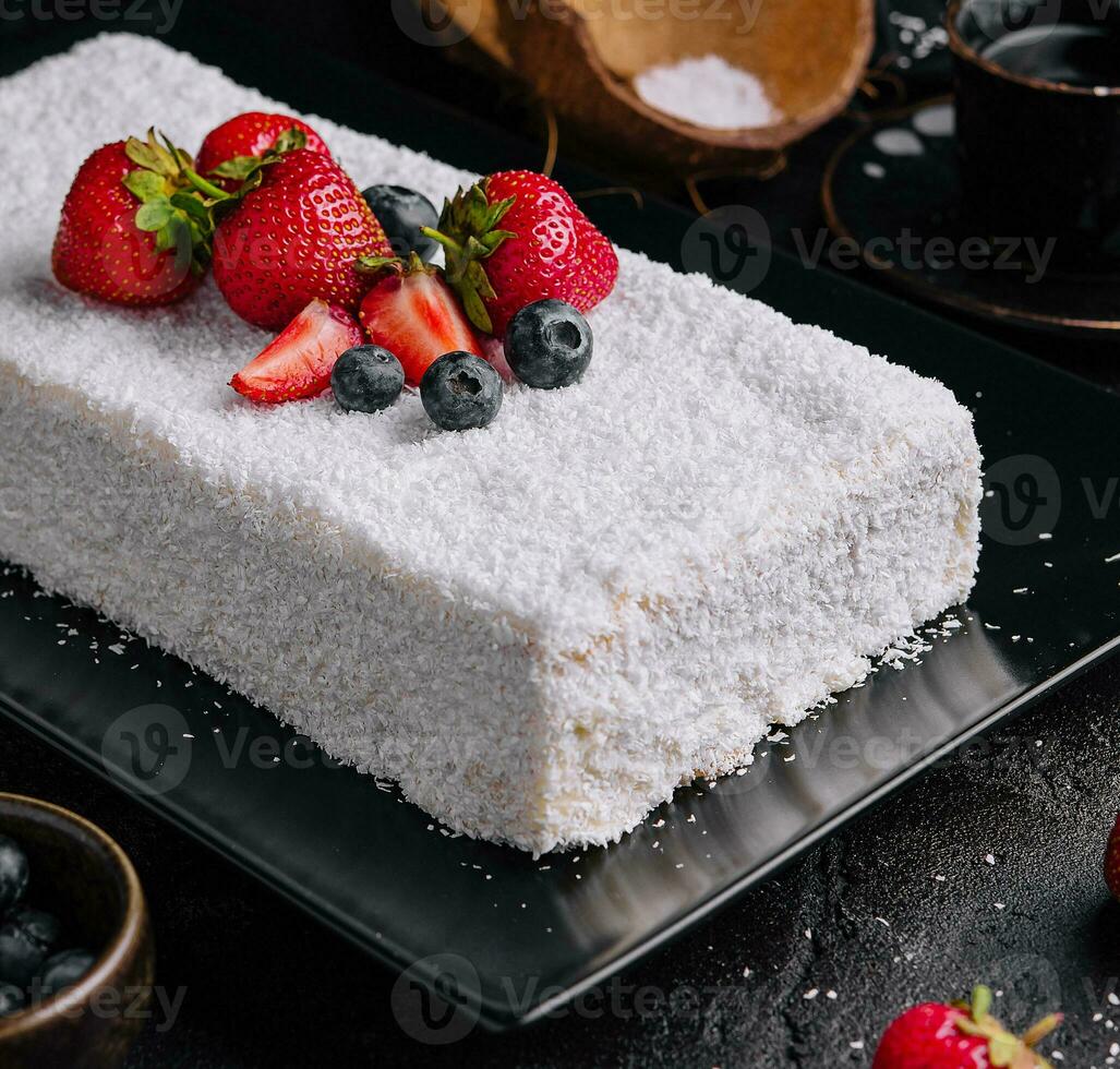 raffaello cake coconut almond cake with berries photo