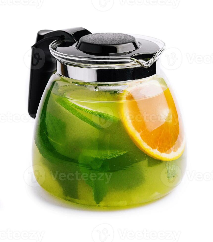 Jug of tasty cold tea on white background photo