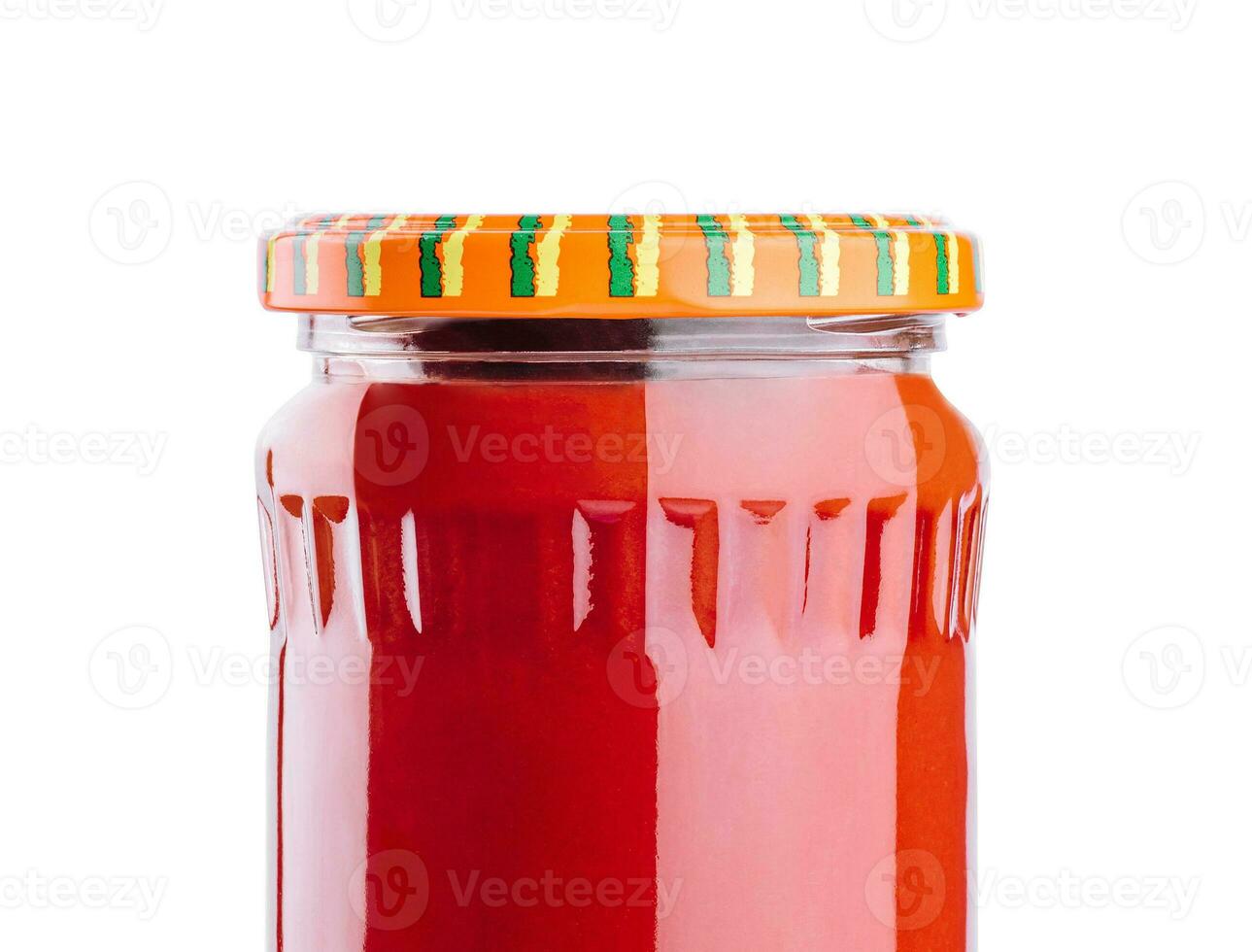 Tasty tomato sauce in glass jar isolated on white photo