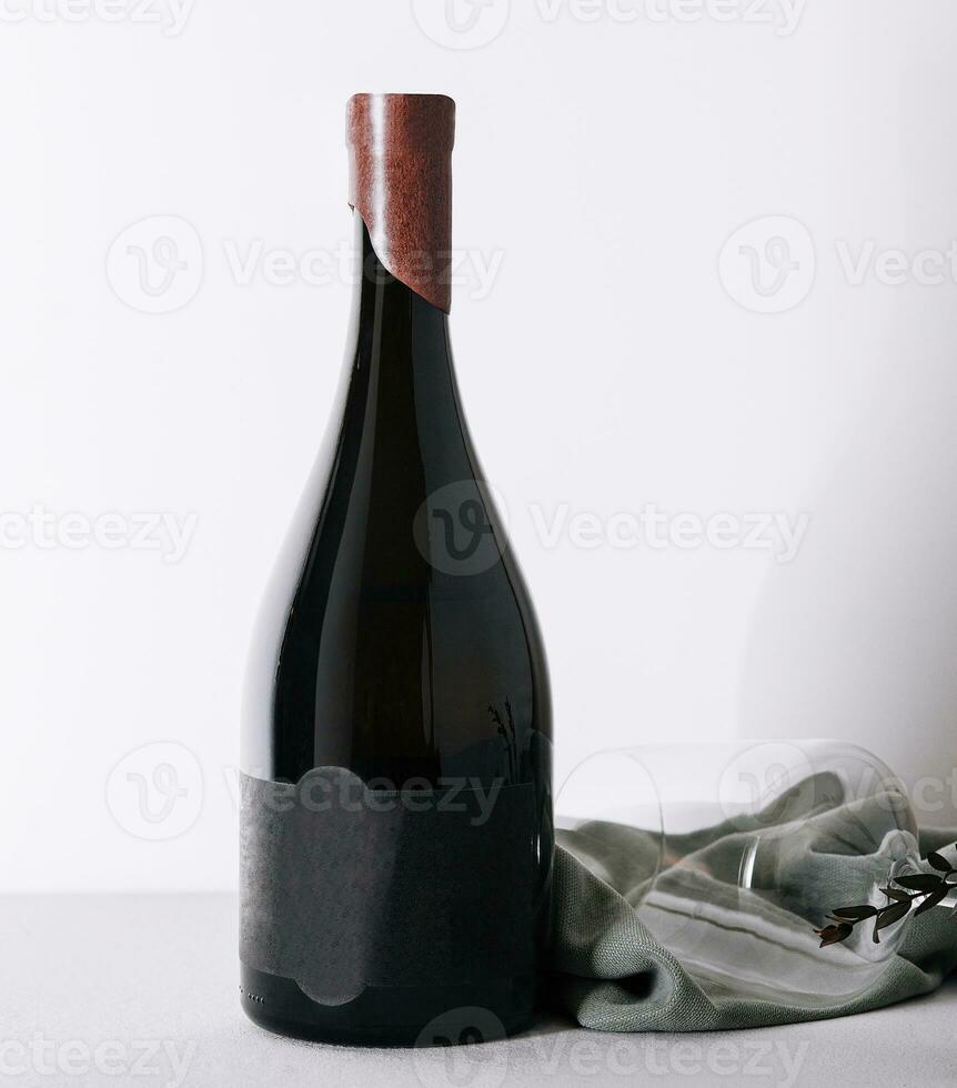 Glass and bottle of red wine photo