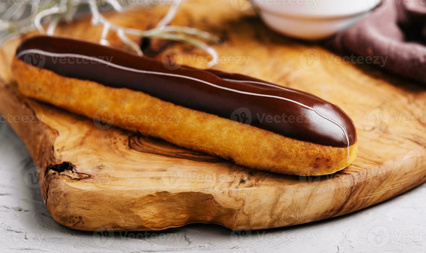 Eclairs with chocolate close up or macro photo