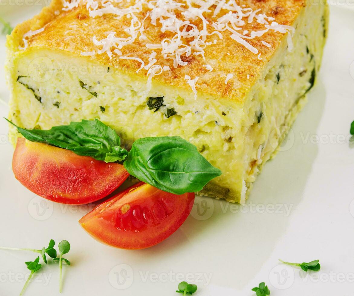 Tasty spinach tart and tomatoes photo