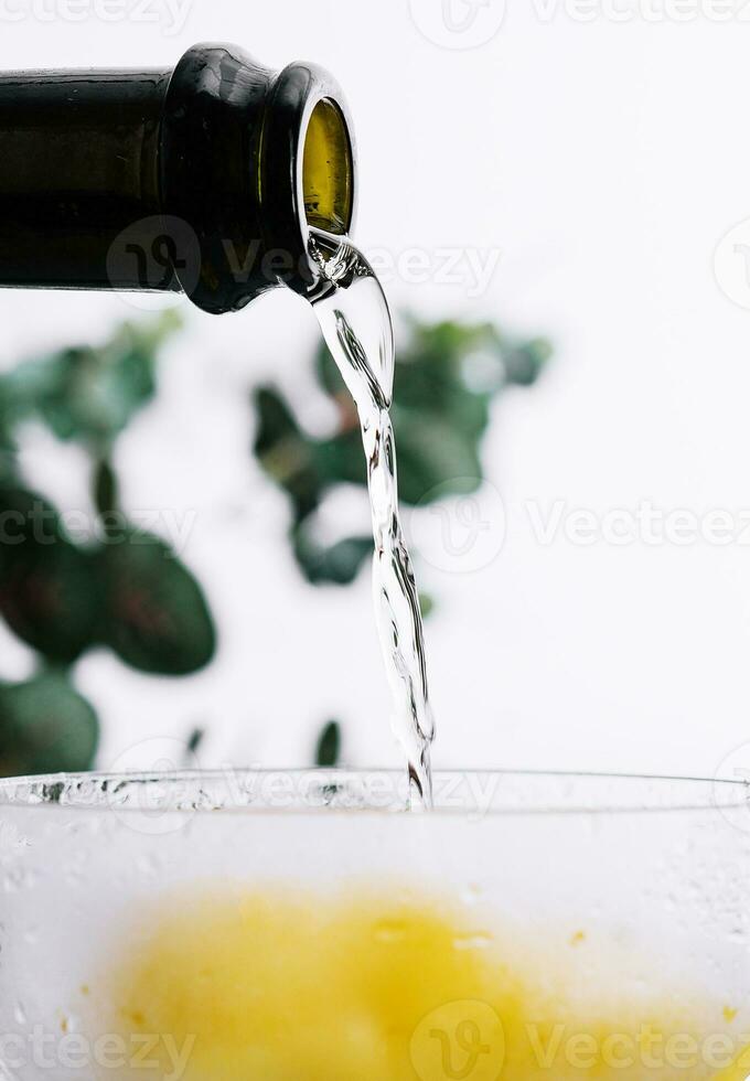 Pouring champagne or prosecco into a glass photo