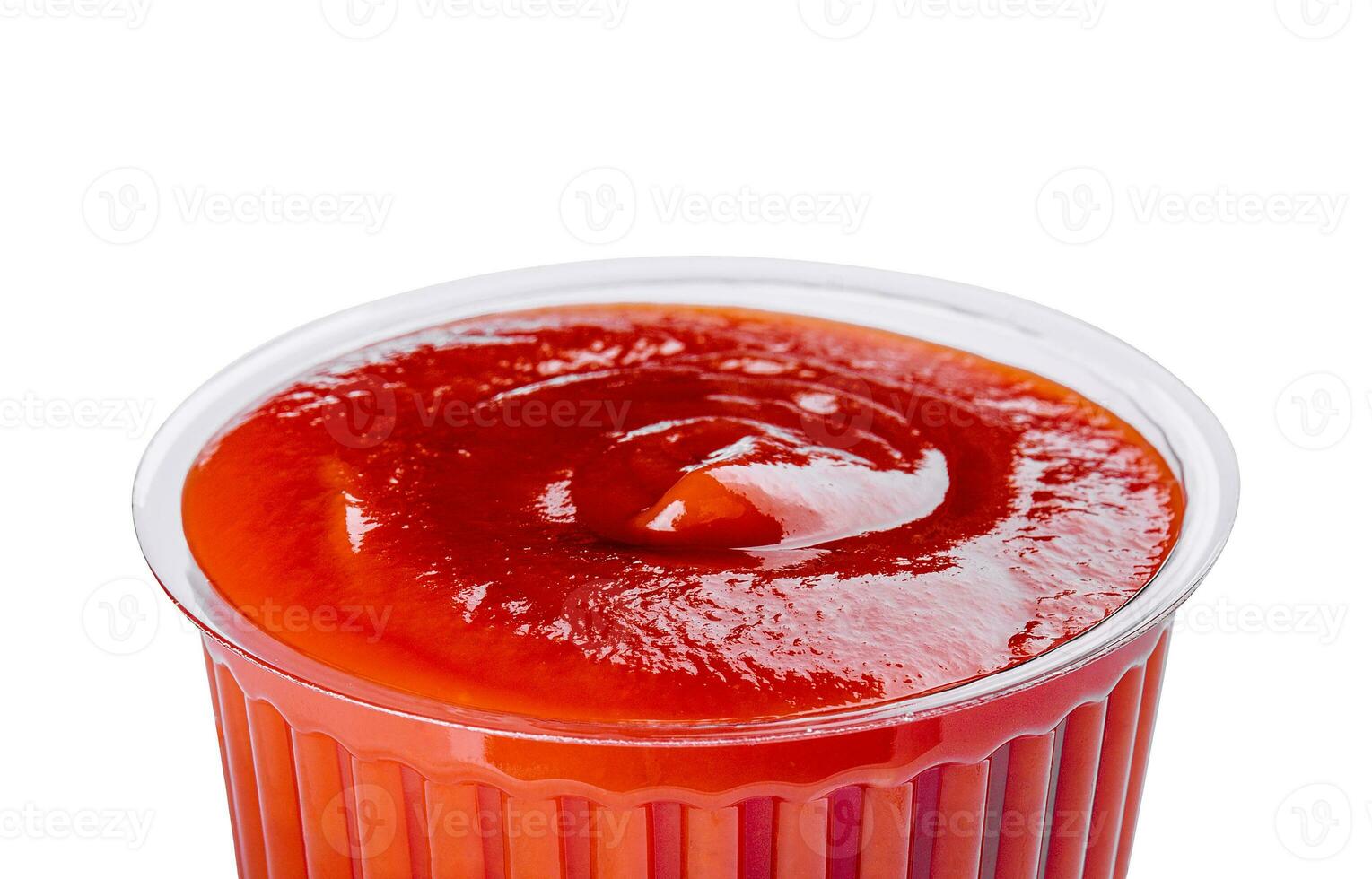 ketchup in a plastic bowl isolated on white photo