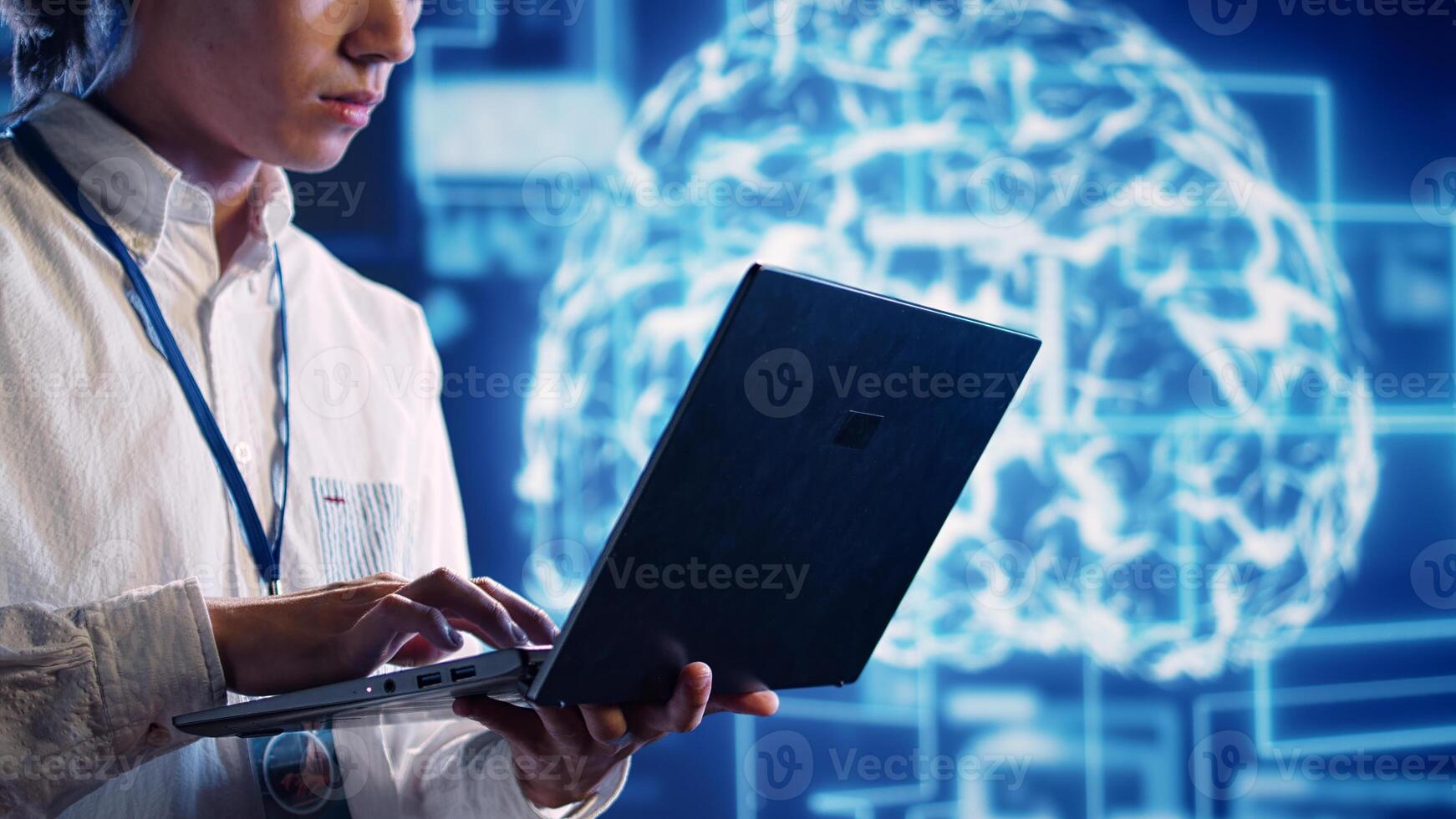 Engineer in cloud computing business uses artificial intelligence computing simulating human brain thought processes. Admin performing operations on laptop with AI machine learning algorithms photo