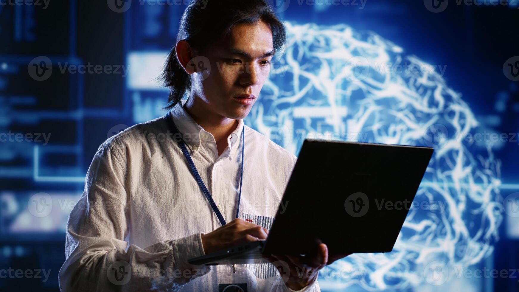 Trained IT consultant works with artificial intelligence computerized model simulating human brain. Professional looks at AI visualization of machine learning algorithms using pattern recognition photo