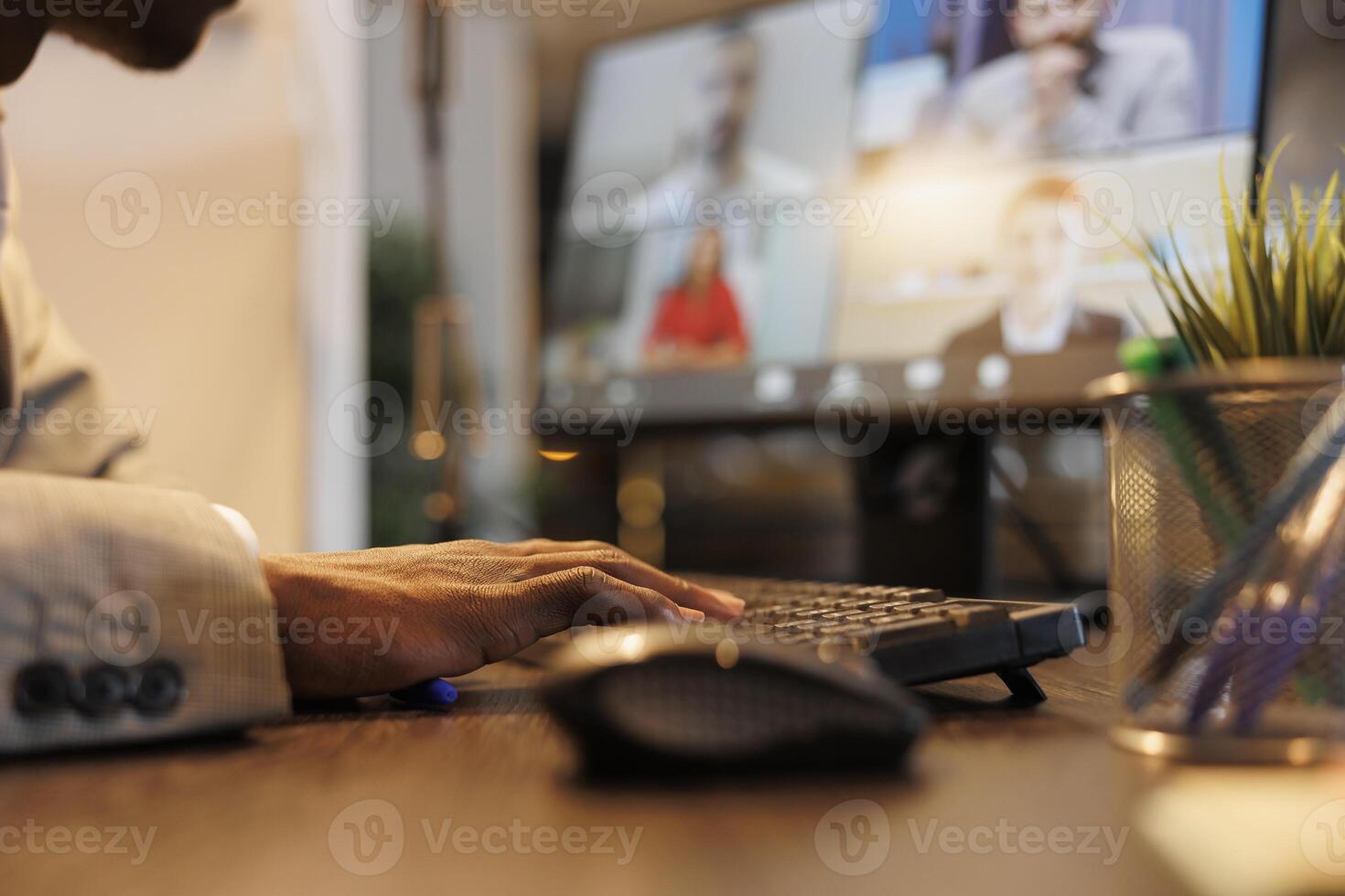 Businessman discussing marketing statistics with remote team during online videocall meeting conference. Diverse colleagues working over hours at company strategy in startup office photo