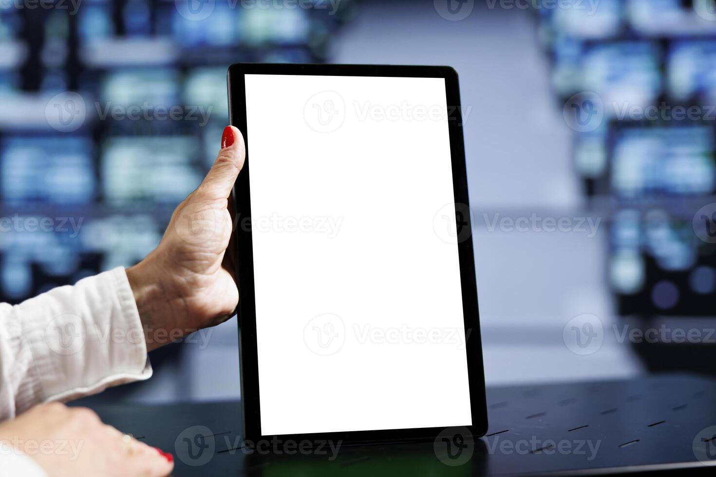 Close up shot of mock up tablet used by qualified IT programmer in data center using server rigs to deliver massive computing power, control network resources, process and store datasets photo