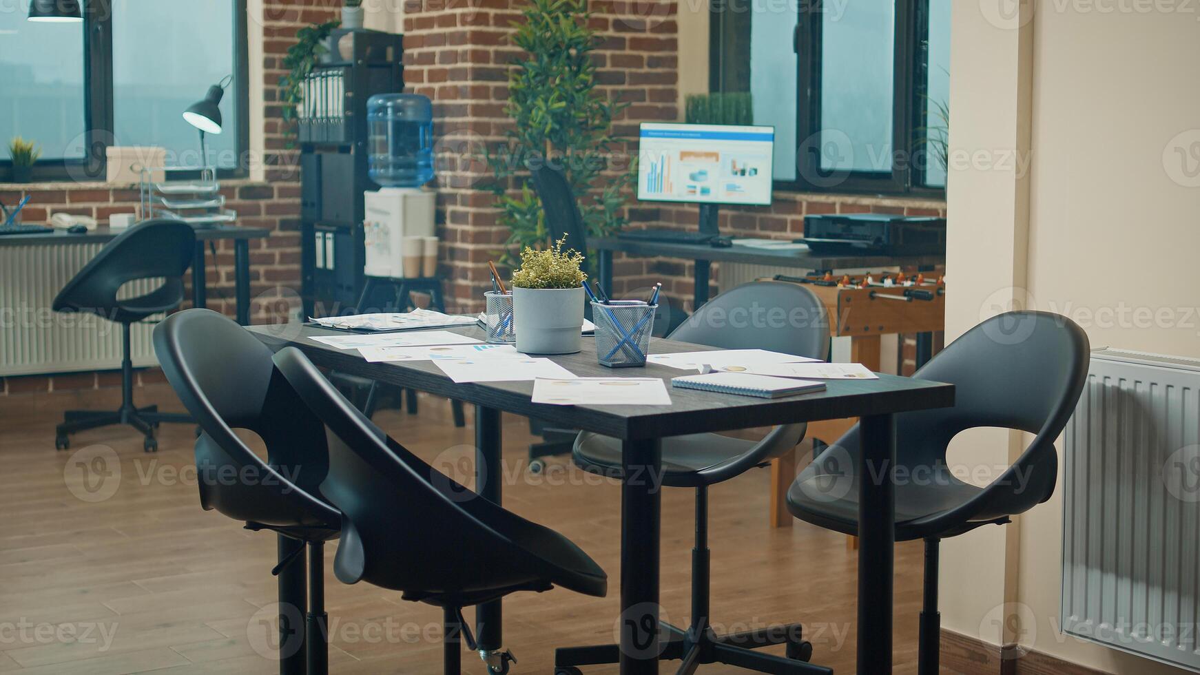Coworking space with executive data on files, empty office desk filled with reports and analysis on papers. Corporate boardroom used for global business development, support strategy. photo
