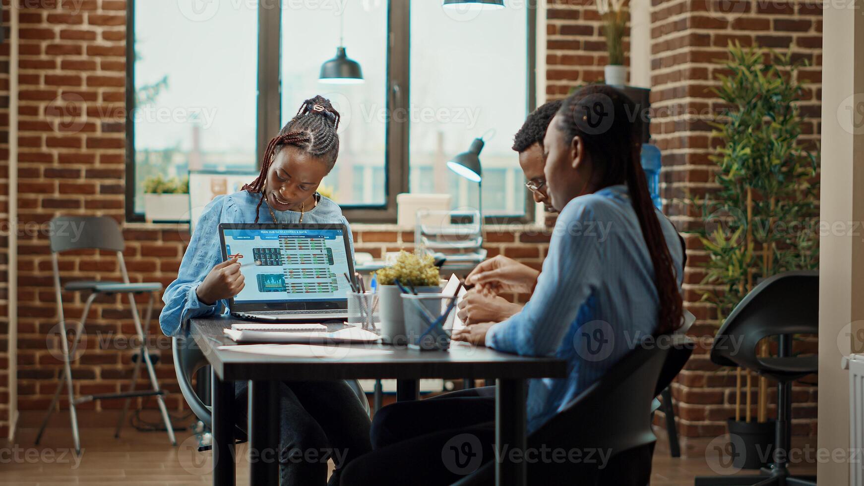 Employees reading annual data reports on files, examining analytics and results online. Business people working on company development with official information on documents, office workstation. photo