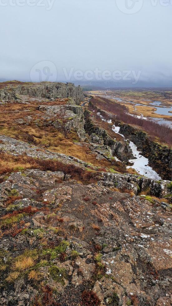 Rocky cliffs icelandic wilderness in national park, majestic natural scenery with massive rock formations inside hiking valley. Spectacular nordic landscape with stone mountain wall hills. photo