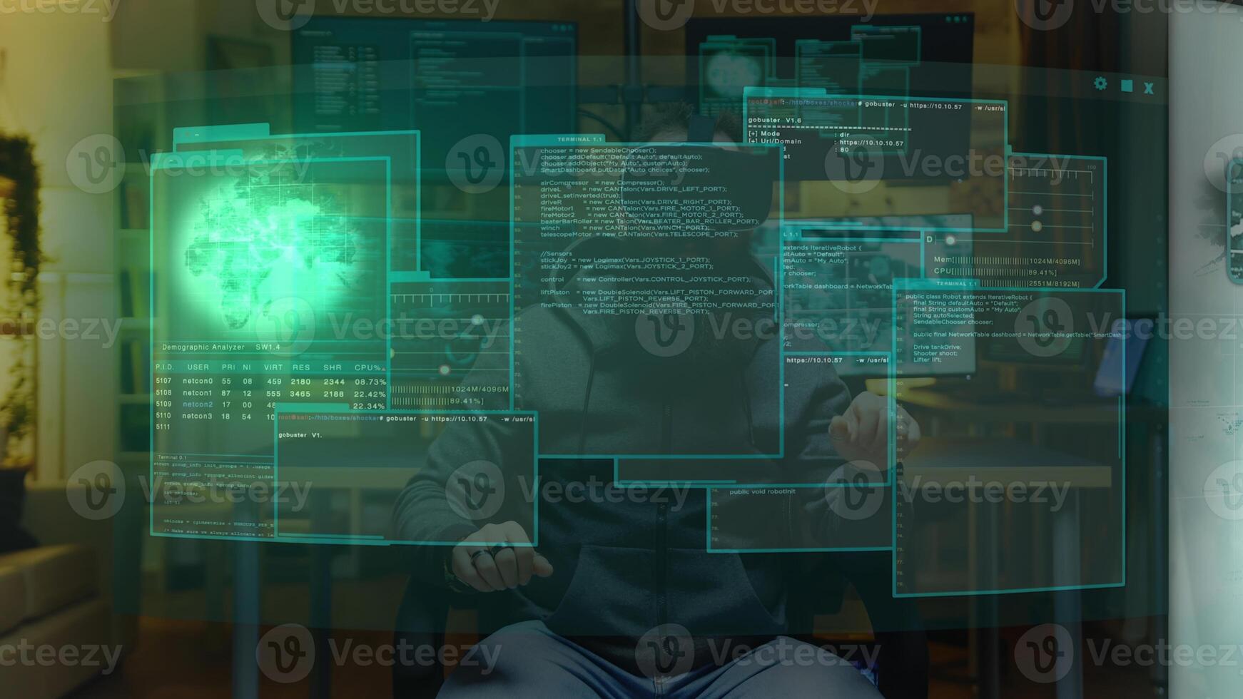 Hacker at home using augmented reality holographic visualization to write malicious code to be used as virus, planning to infect businesses internal servers, steal valuable data and demand ransom photo
