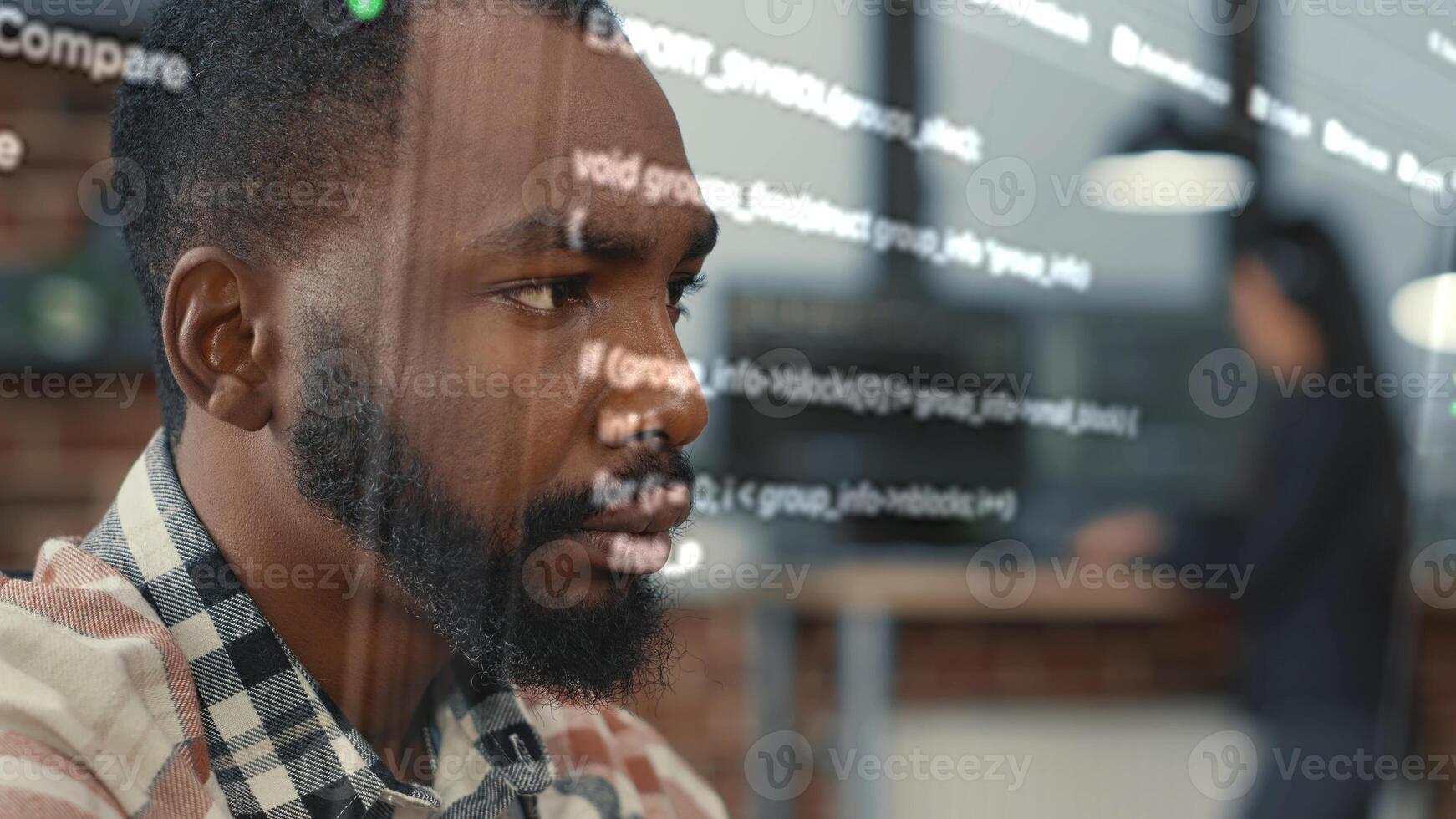 Developer helped by augmented reality to visualize script, writing code on computer screen while in workspace using Java programming languages. African american licensed professional mending errors photo