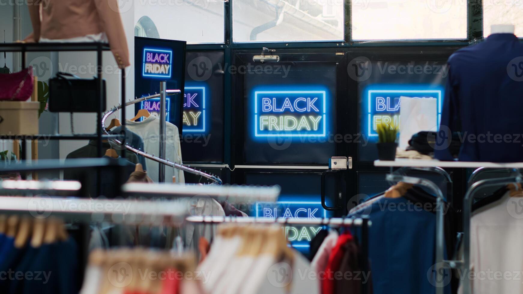 Black Friday november sales day at shopping center, retail shop decorated with big sales labels and discounted items. Empty fashion boutique with cheap clothes, clearance outlet concept. photo
