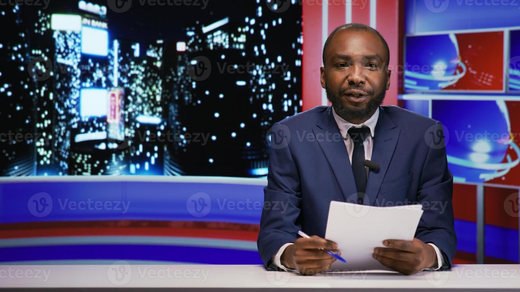 Host on late night talk show does newscast, presenting international events on entertainment media segment. African american journalist discussing about world problems and latest scandals. photo