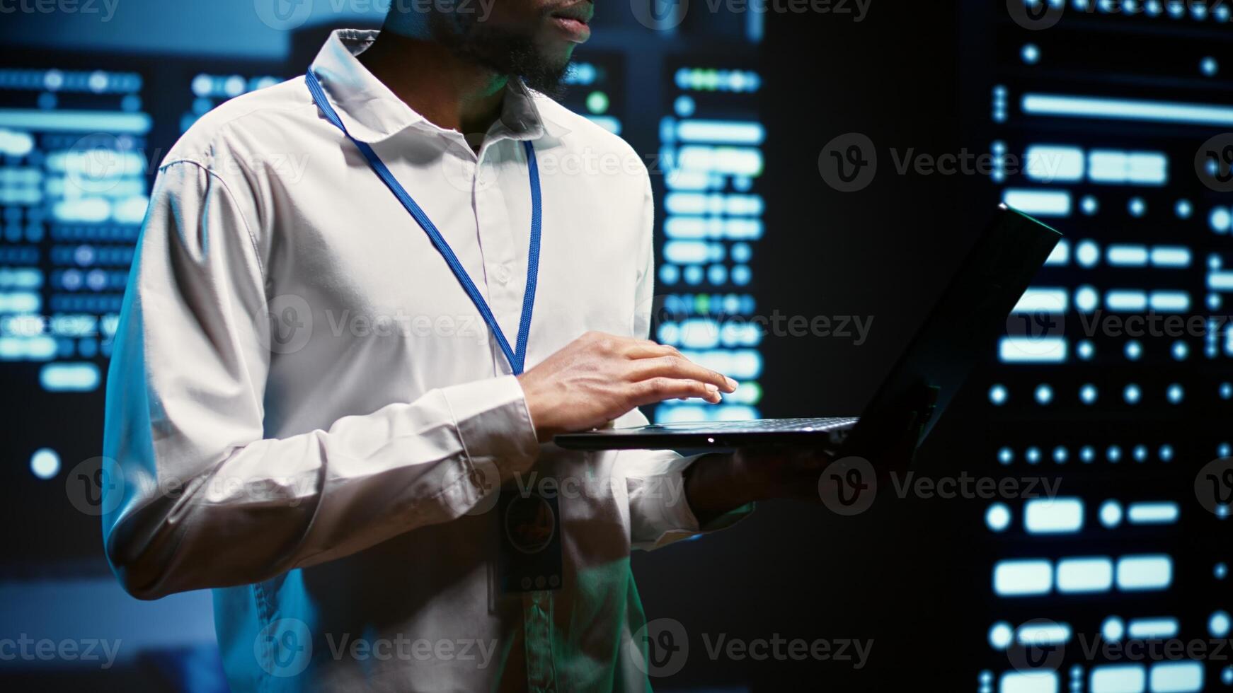 Engineer making sure servers in cloud computing business service are correctly equipped to provide redundancy, automatic failover and rapid reconfiguration of clusters to minimize failure of hardware photo