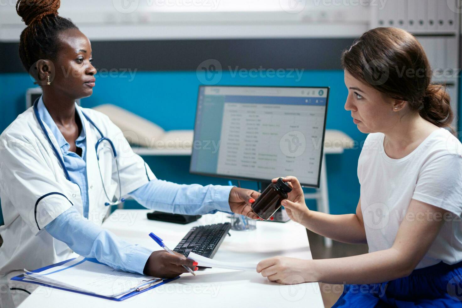 General practitioner doctor offering clinical consultation to patient. medicine. Healthcare specialist during checkup prescribing pill bottle medicine to woman in modern clinic photo