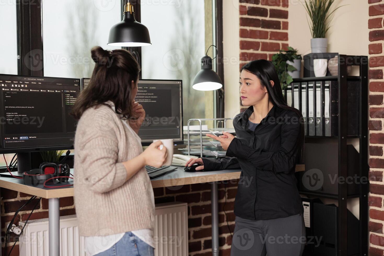 Multi ethnic system engineers developing software algorithm for information processing and network optimization. Software developers programming it application working in company office photo
