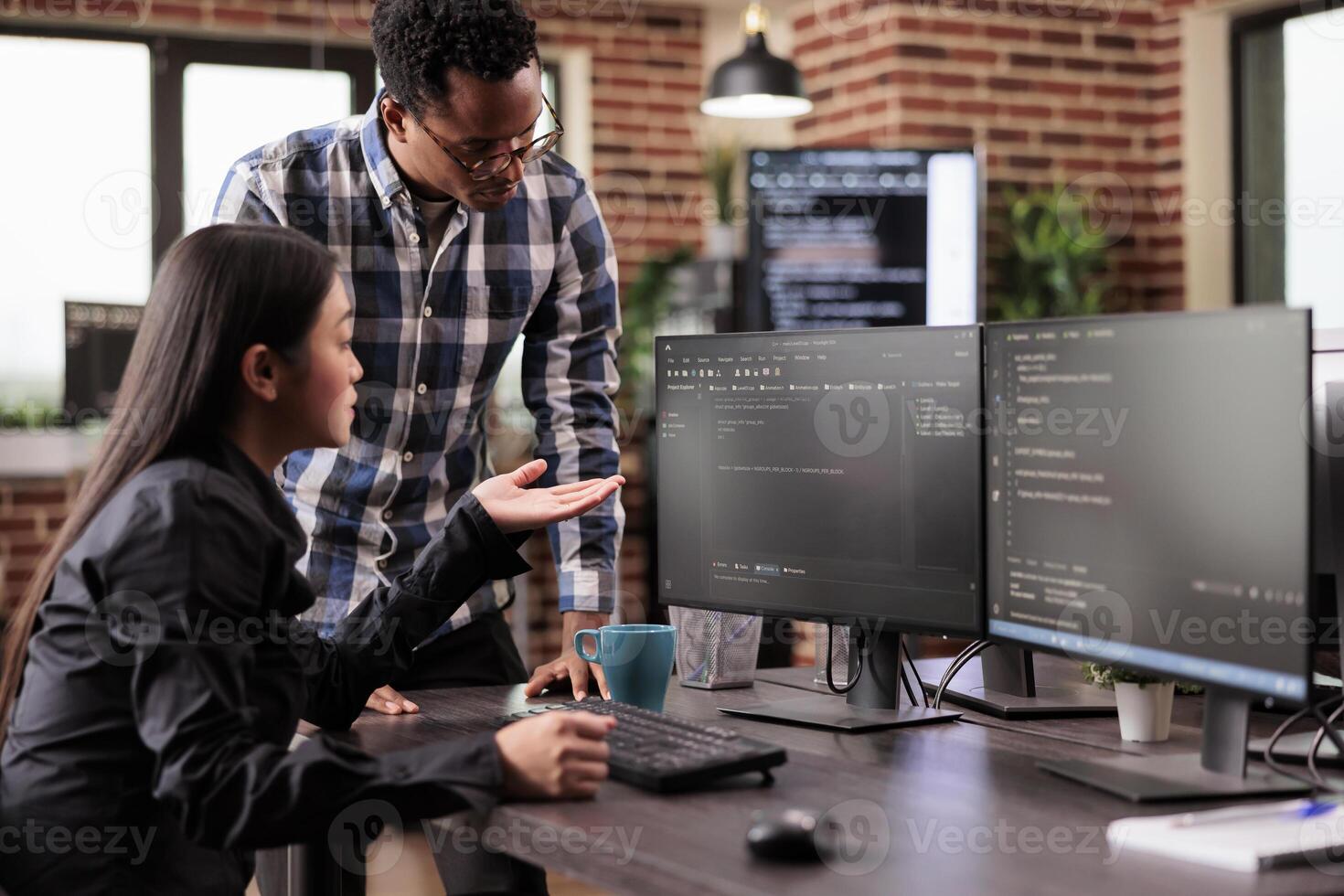 Diverse team of system engineers developing html code and cloud computing in it development agency. Asian software developer typing on keyboard to create artificial intelligence script. photo