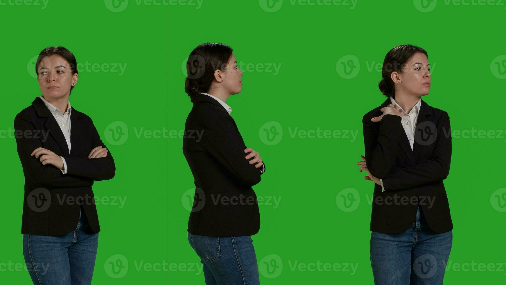 Close up of focused businesswoman standing over greenscreen backdrop, acting optimistic and confident in studio. Corporate worker wearing office suit on camera, stylish manager. photo
