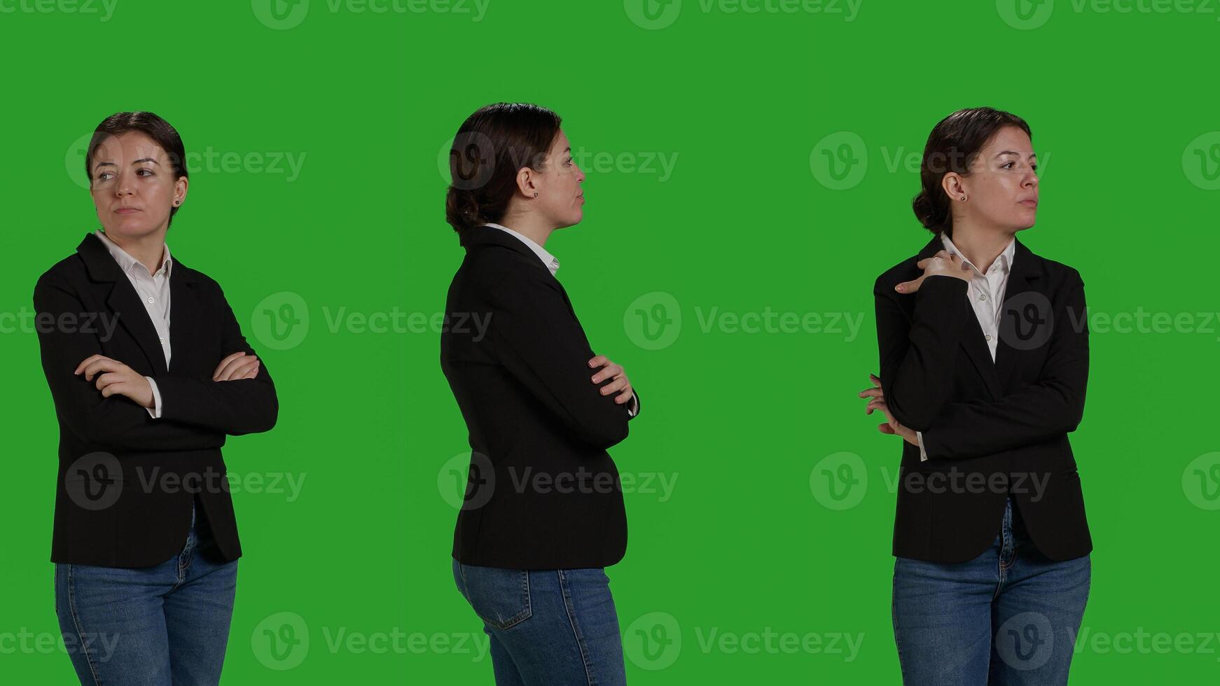 Close up of focused businesswoman standing over greenscreen backdrop, acting optimistic and confident in studio. Corporate worker wearing office suit on camera, stylish manager. photo