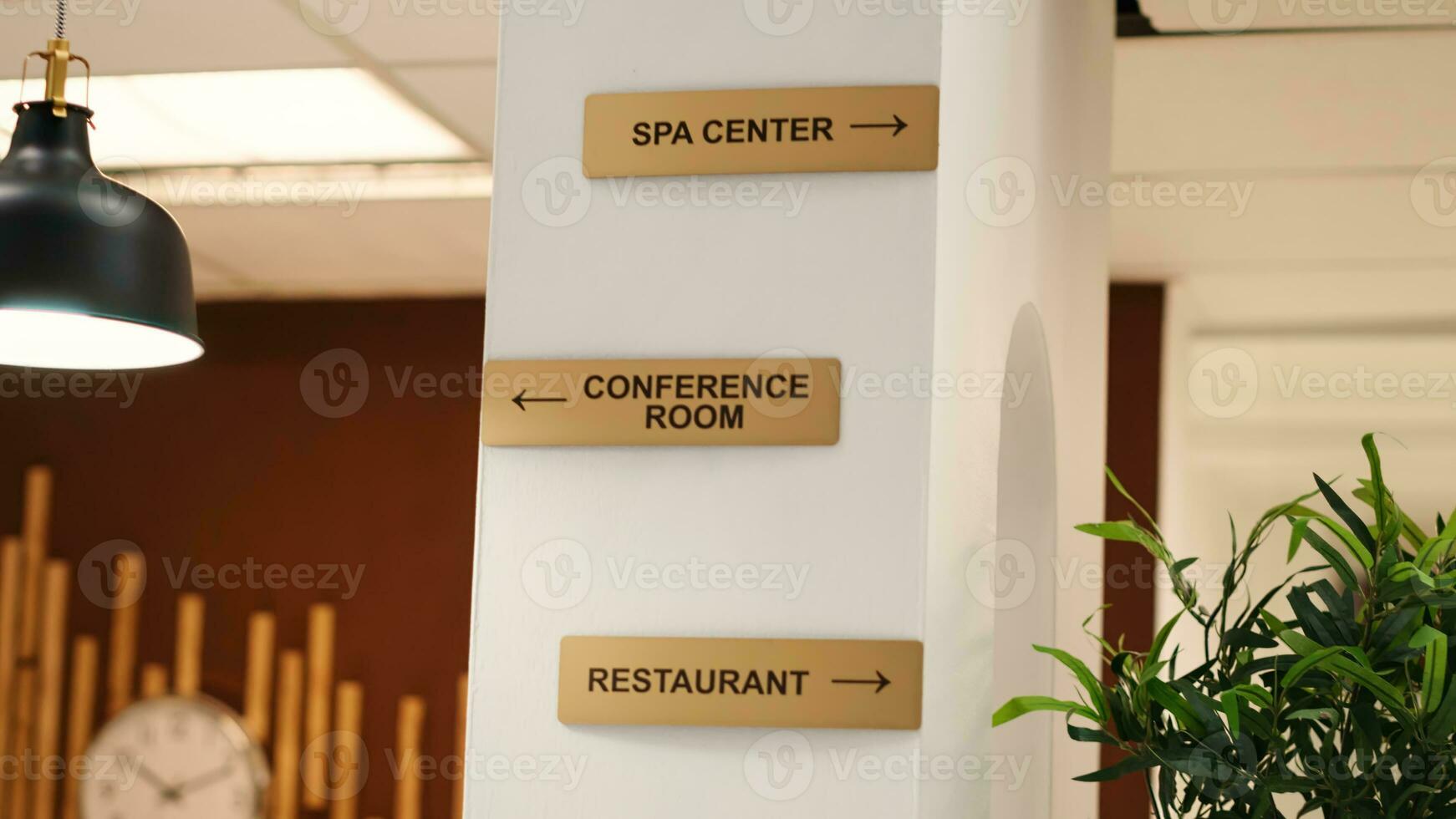 Empty stylish business accommodationlobby interior with luxurious deluxe conference room, spa center and restaurant amenities. Close up of hotel facilities plaque signs on resort lounge wall photo