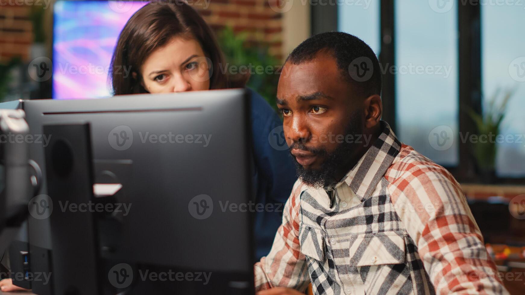 Diverse team of employees working on software development with manufacturing interface, infographics. IT engineers brainstorming ideas to develop production with artificial intelligence. photo