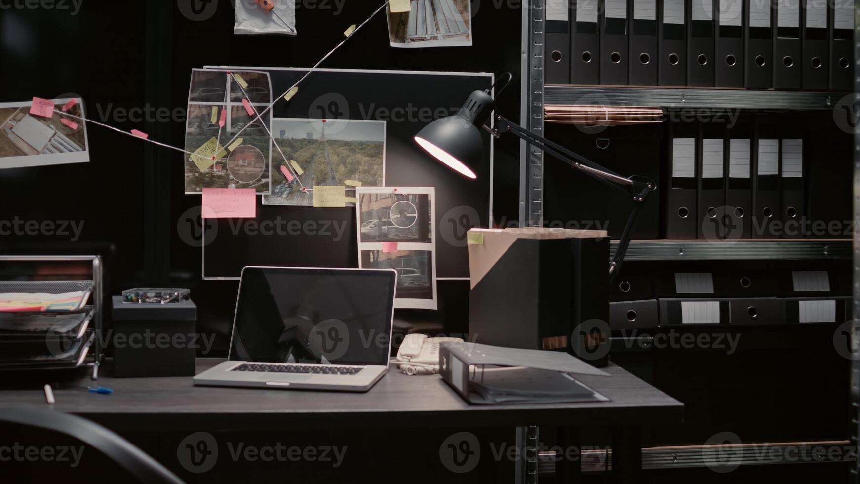 Evidence board with case files or investigation clues on police archive wall map, surveillance phots and witness statements. Empty law enforcement office filled with criminal records. photo