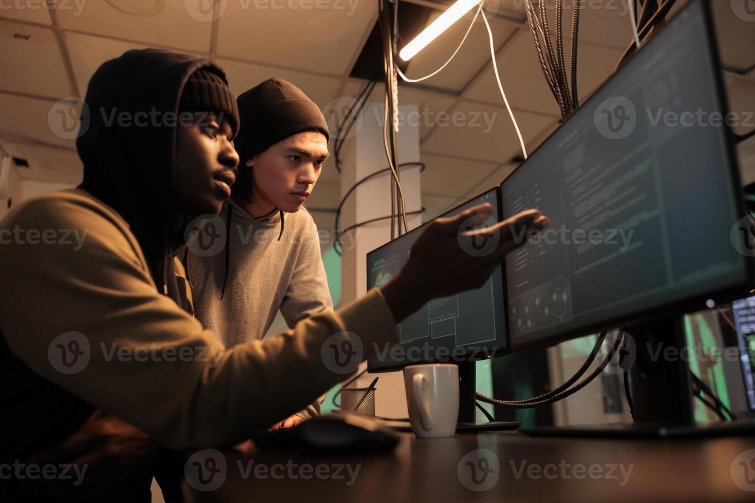 Hackers team cyberattack, criminals stealing privacy information, data breach. Cybercrime, diverse internet thieves hacking computer system, breaking into banking account at night time photo