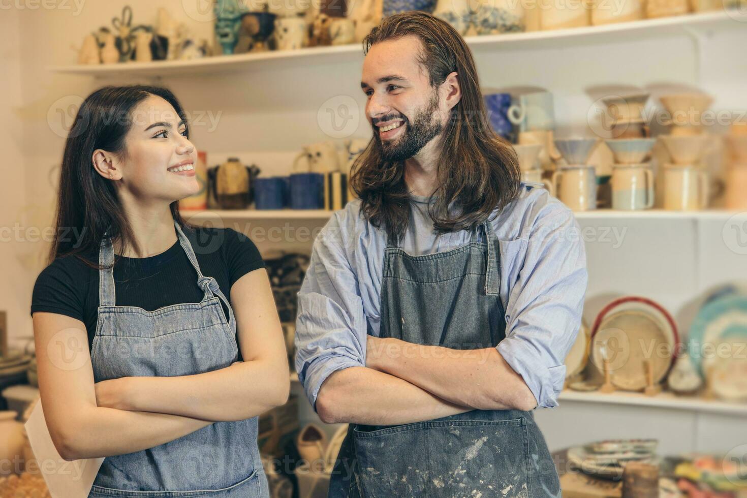 happy young business owner couple friends lover with pottery ceramic shop store photo