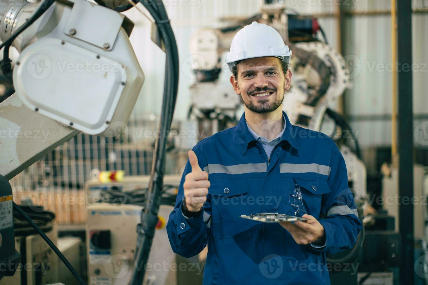 Engineer worker Hispanic Latin in Machine Robotic modern Automation Industry. Happy Mechanic staff employee in metal factory. photo