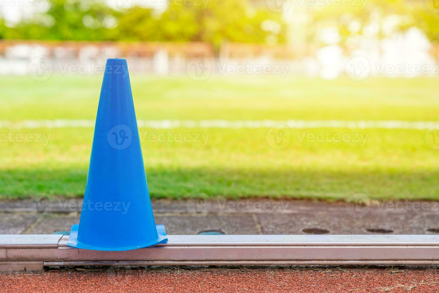 football grass field running track and training cone for sport exercise outdoors activity background photo