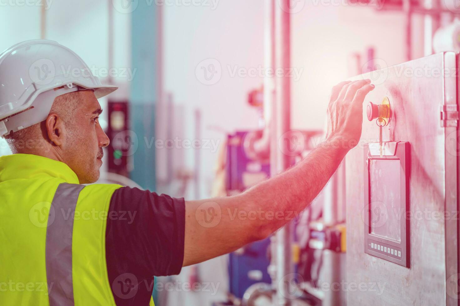 factory engineer staff pressing Emergency Stop Switch machine  malfunctioning for safety photo