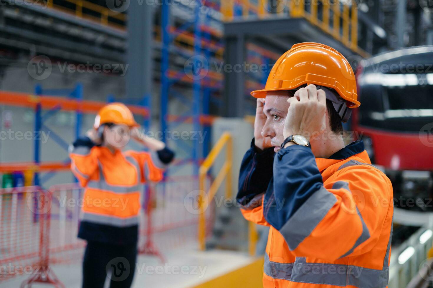 Engineer team worker check safety helmet clothing for work electric train service depot transport industry factory technician mechanic staff. photo