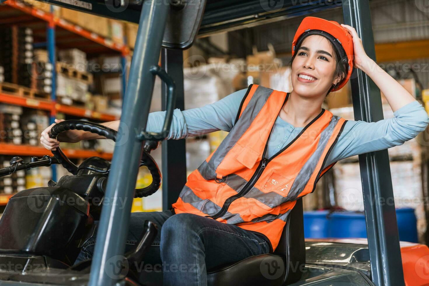 happy young teen warehouse staff worker enjoy smiling at forklift driver for control loading factory inventory shipping products photo
