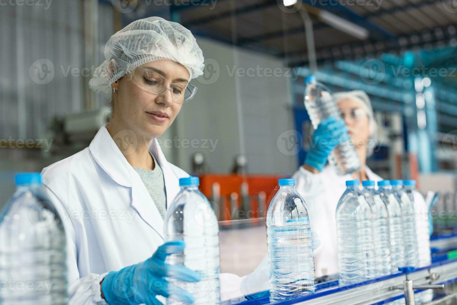 women worker in drink factory work at production line with hygiene uniform focus at work photo