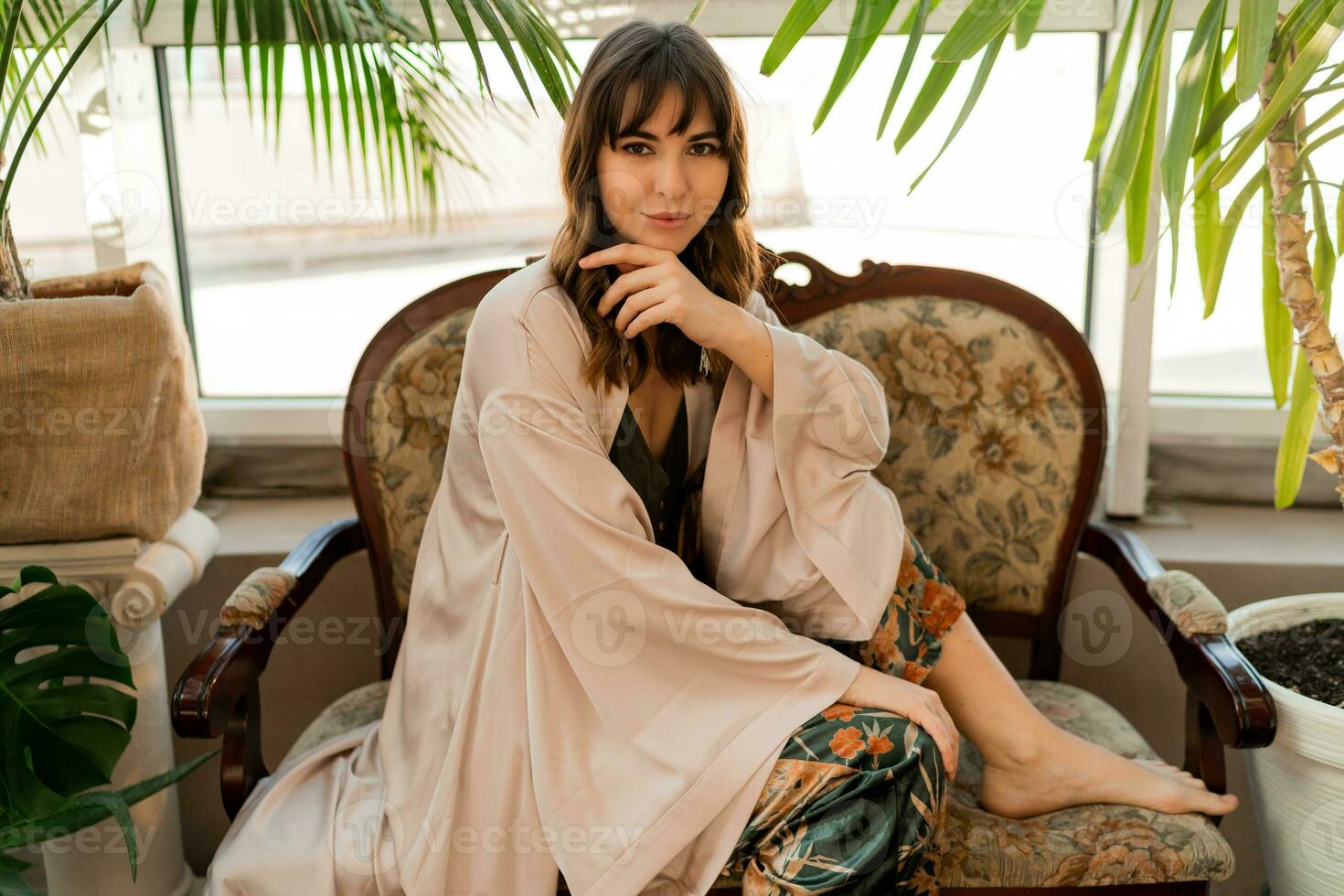 Woman in elegant sexy home wear enjoing morning in stylish living room. photo
