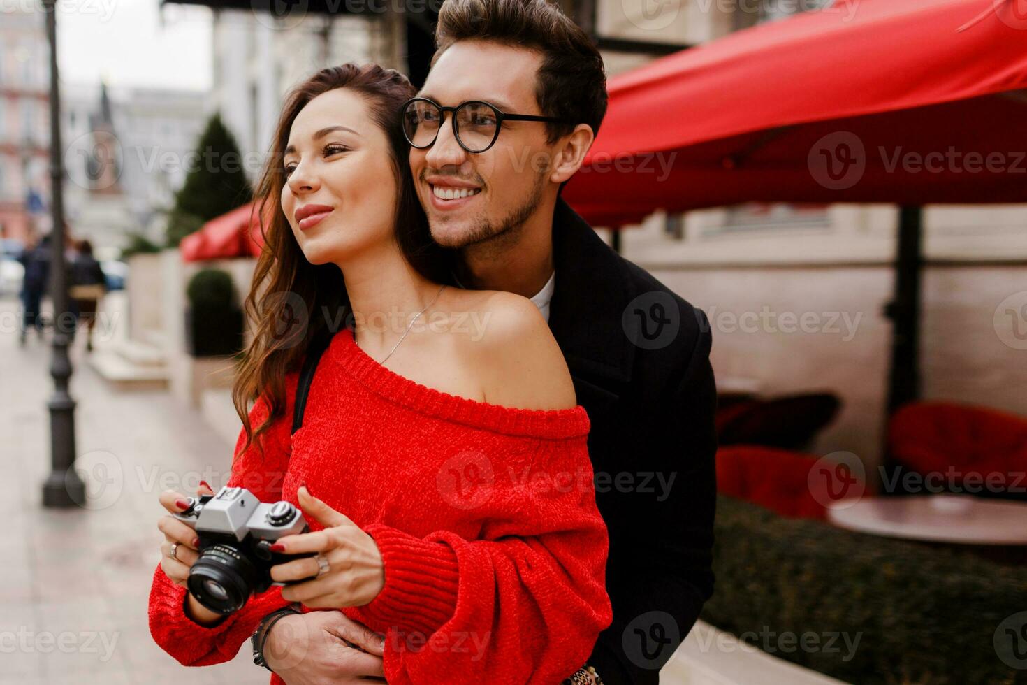 Happy traveling couple embarrassing and  posing on the street on holiday. Romantic mood. photo