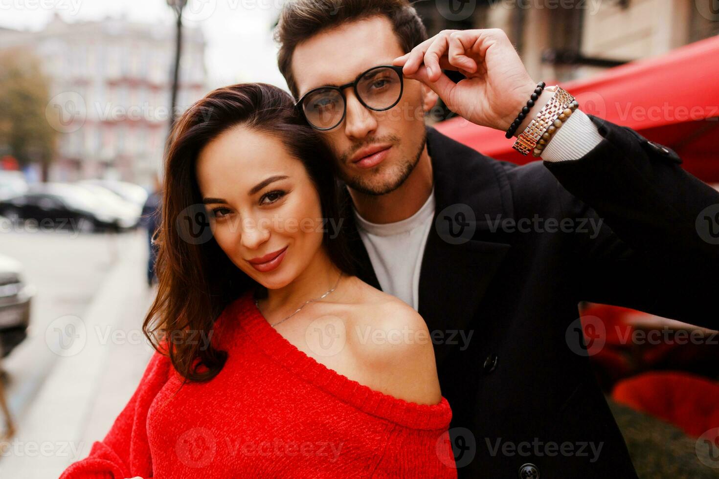 Close up portrait of happy lovely brunette woman and handsome man in glasses. Outdoor. photo