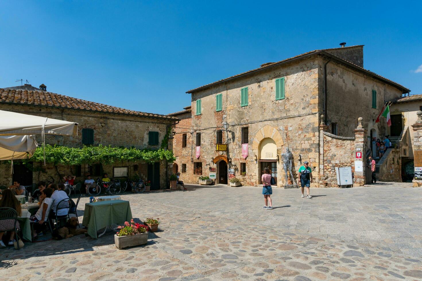 Monteriggioni,Italy-august 10, 2020-View of medieval village of Monteriggioni from above the walls during a sunny day photo