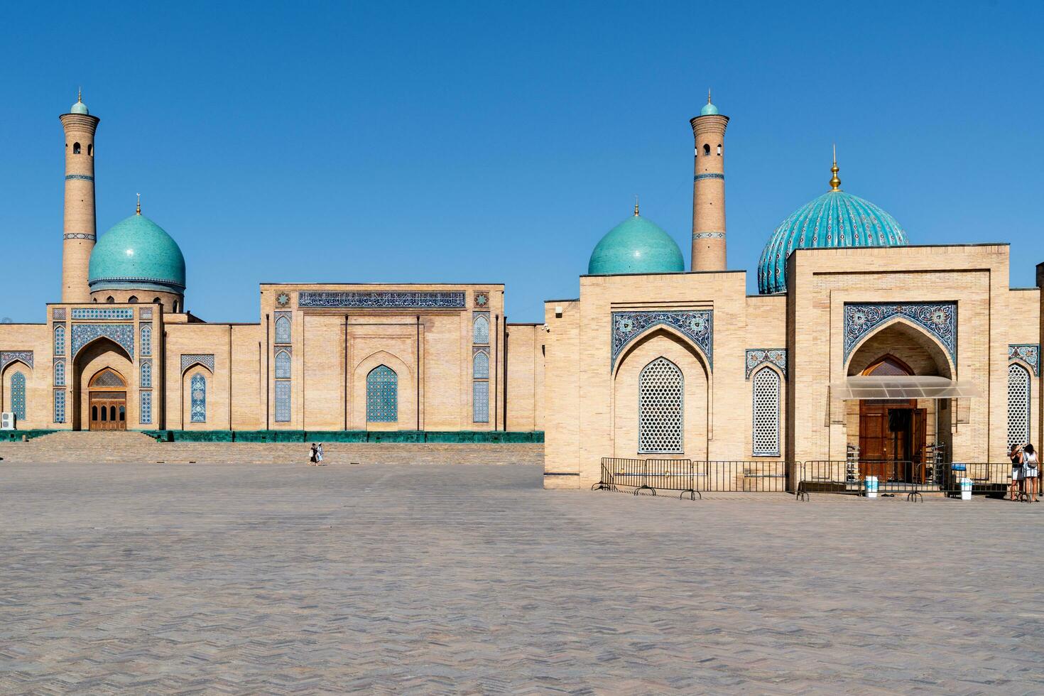 Tashkent, Uzbekistan-august 11, 2023-people visit the Hazrati Imam complex during a sunny day.The complex is a square that includes a set of religious buildings in Tashkent photo