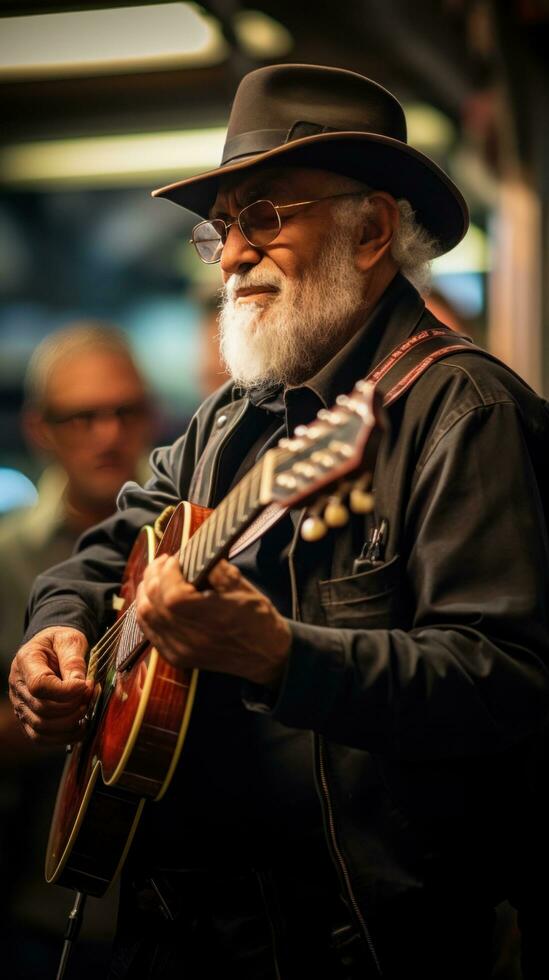 musician plays guitar on the street among a crowd of people photo