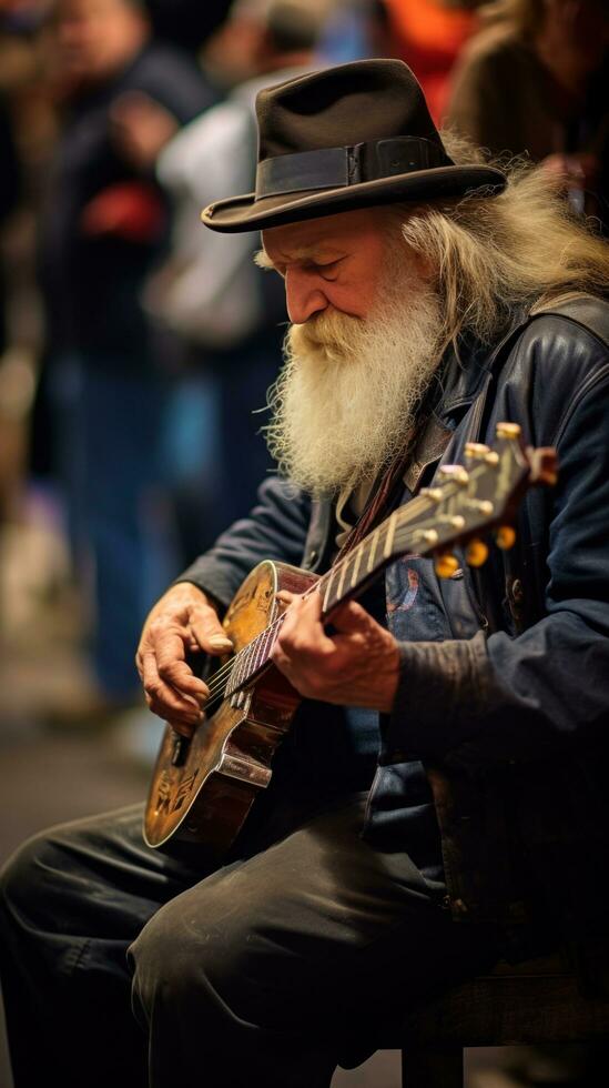 musician plays guitar on the street among a crowd of people photo