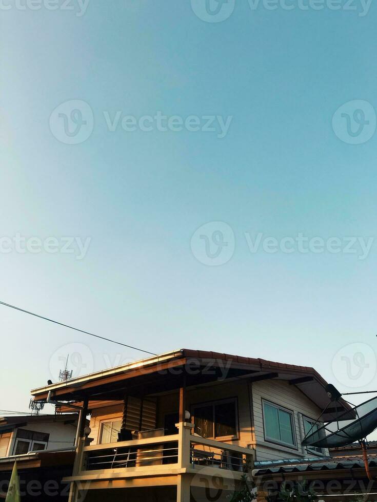 photovoltaics on the roof of a house and a beautiful sky with the setting sun. Concept of sustainable resources photo