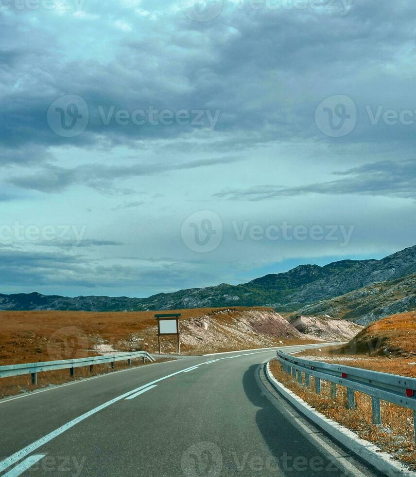 view of a autumn day in the mountains, green meadows, mountain slopes and hills photo