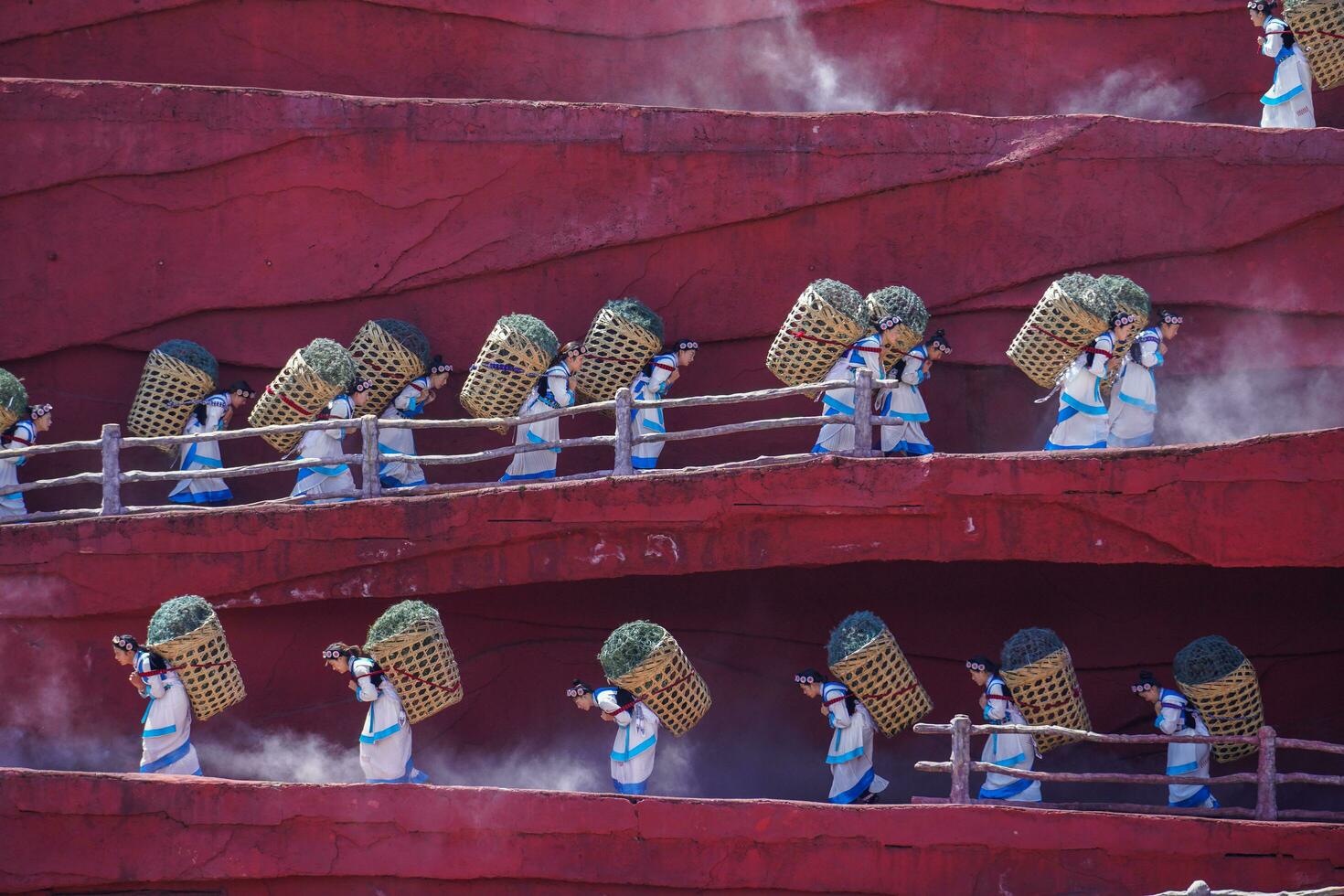 Lijiang ,China- SEP 04,2023 -Impression Lijiang is a grand traditional show located in the Jade Dragon Snow Mountain scenic area, Lijiang, Yunnan, China. photo