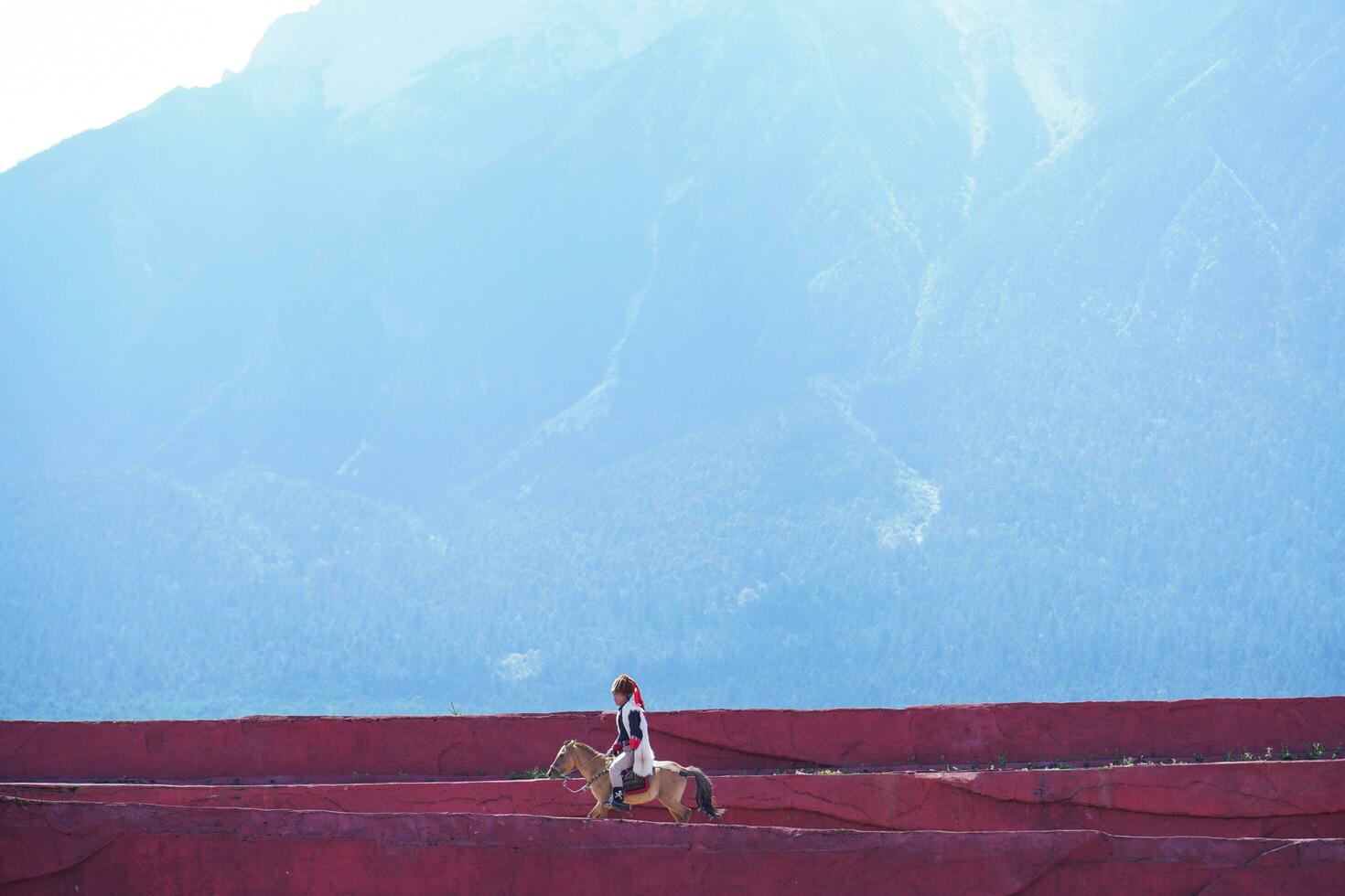 Lijiang ,China- SEP 04,2023 -Impression Lijiang is a grand traditional show located in the Jade Dragon Snow Mountain scenic area, Lijiang, Yunnan, China. photo