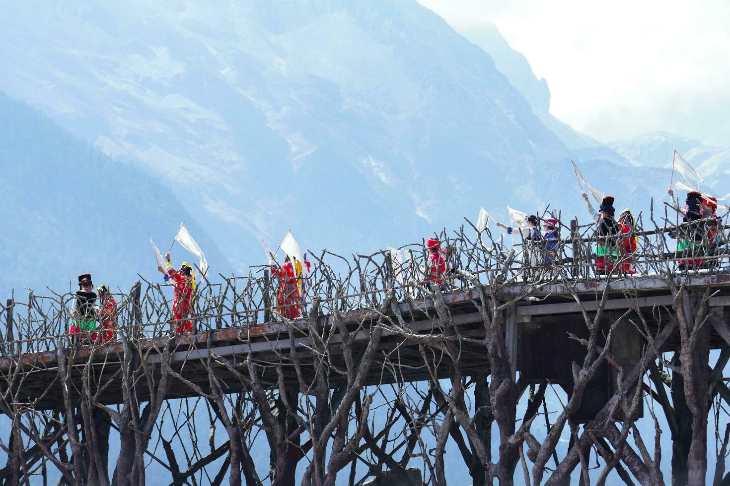 Lijiang ,China- SEP 04,2023 -Impression Lijiang is a grand traditional show located in the Jade Dragon Snow Mountain scenic area, Lijiang, Yunnan, China. photo